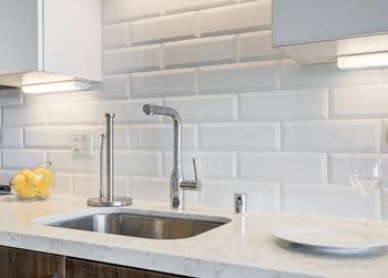 a kitchen with a sink and a faucet